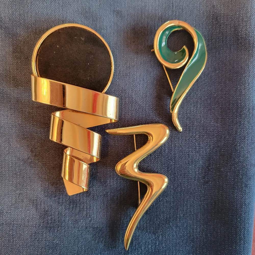 Trifari trio brooches